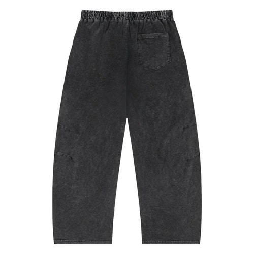 Black washed streetwear pants with elastic waistband and single back pocket, urban style