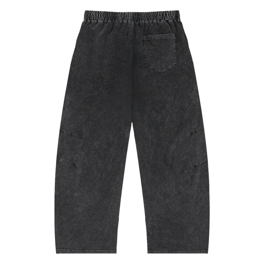 Black washed streetwear pants with elastic waistband and single back pocket, urban style